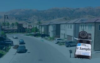 aliso canyon houses and community with blue overlay and air monitoring device
